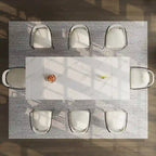 Mesa de comedor moderna minimalista extensible de 240 cm con tapa de piedra sinterizada y doble pedestal